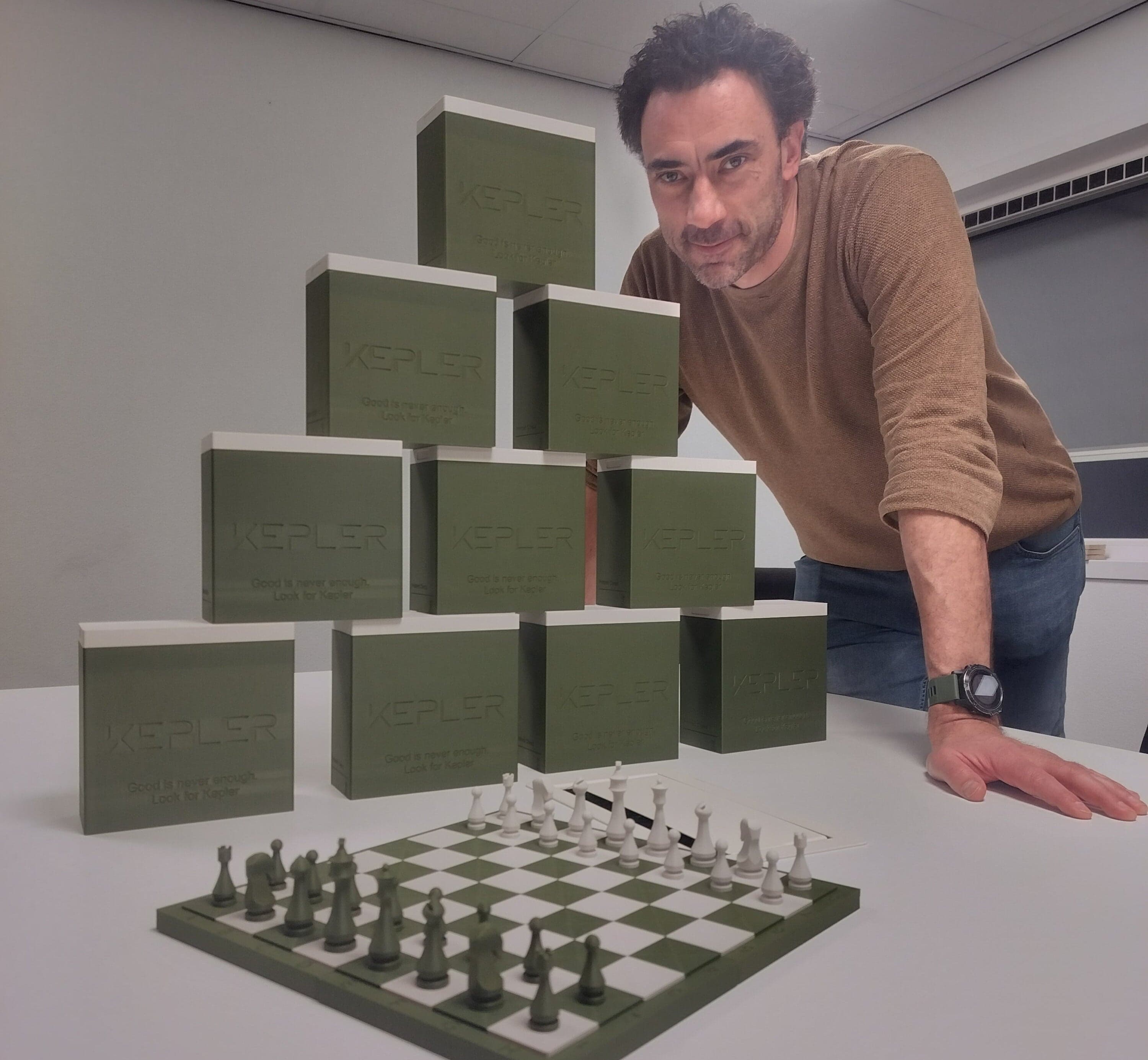 Dennis Vangeneugden of Kepler with the custom-branded chess set boxes