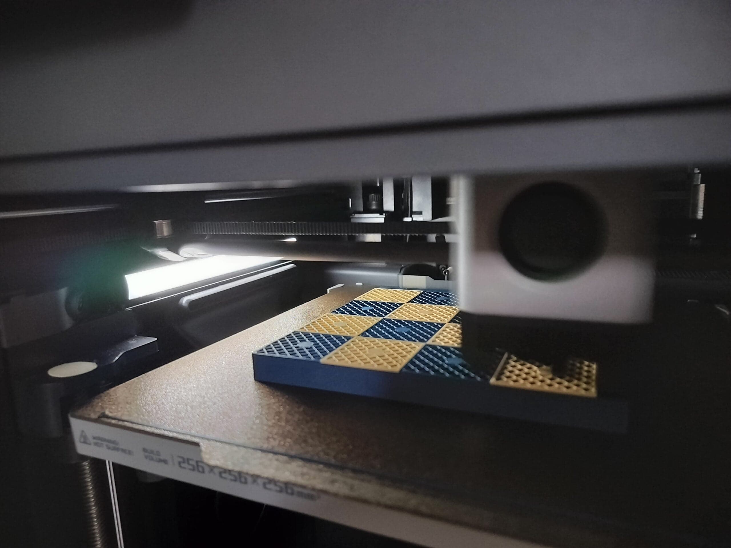 A modular chess board being 3D printed layer by layer
