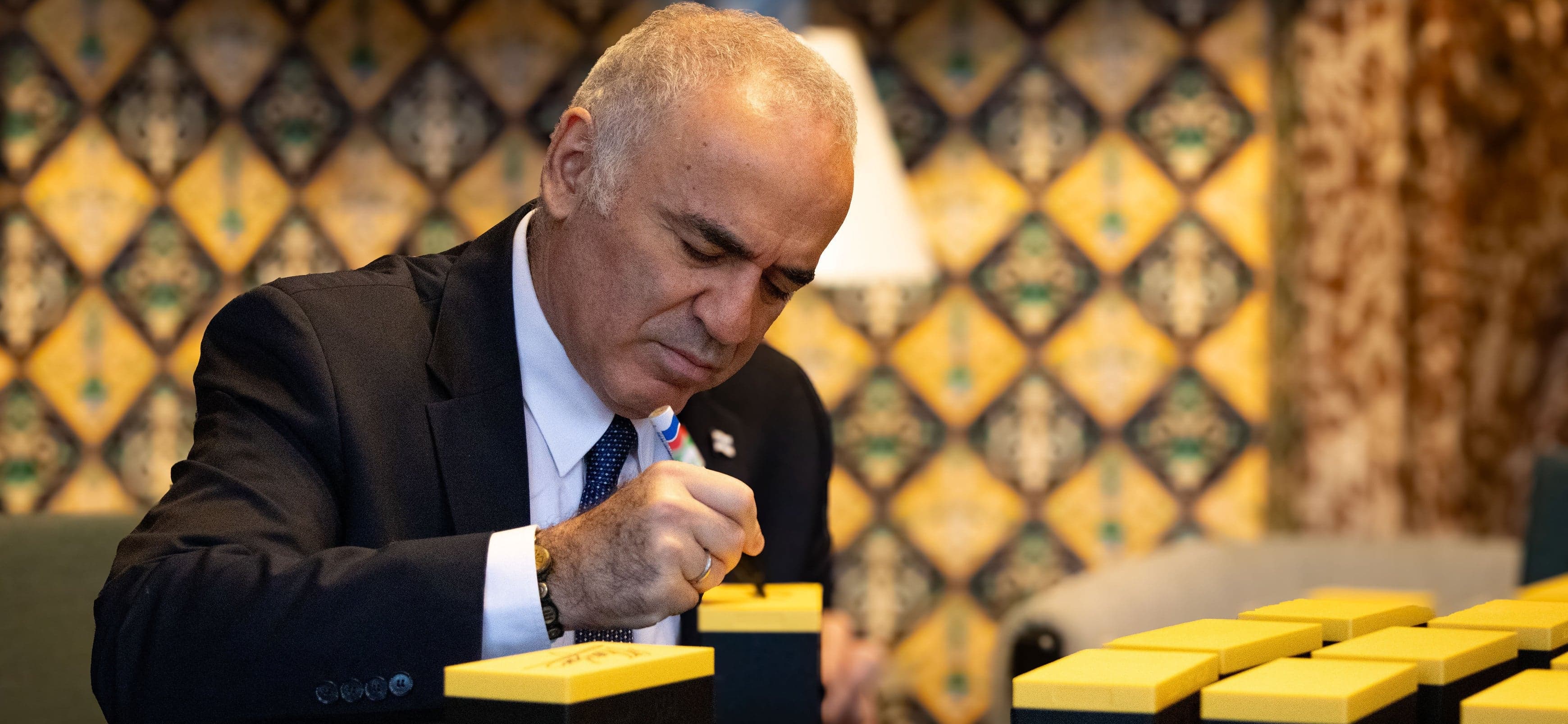 Grandmaster Garry Kasparov signing custom Printed Chess boards